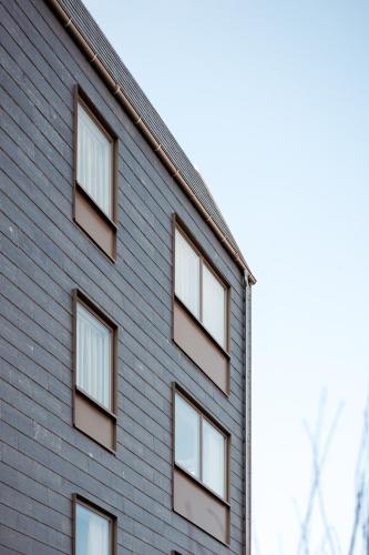 a building with windows on the side of it at Clover House by Daniel&Jacob's in Copenhagen