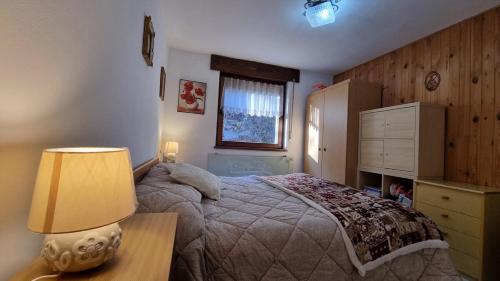 Postel nebo postele na pokoji v ubytování Il Focolare del Cermis