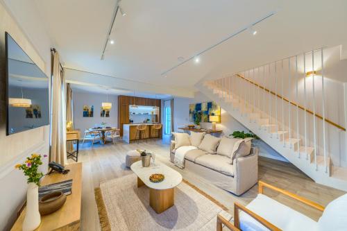 a living room with a couch and a table at Hotel Brattia, Adults Only, Heated Pool, A la Carte Breakfast, Postira, Brač Island in Postira