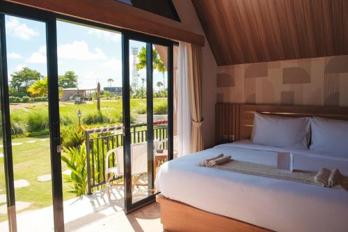 Postel nebo postele na pokoji v ubytování Padi Villa Canggu