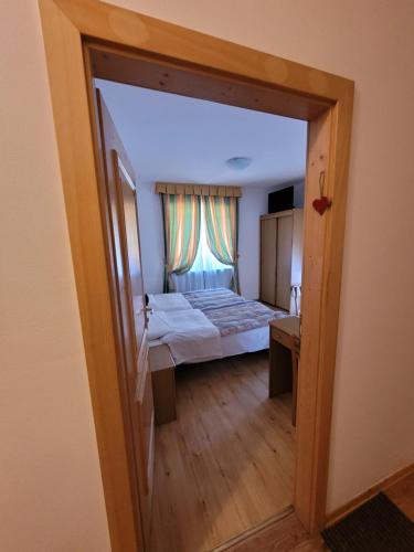 Ένα ή περισσότερα κρεβάτια σε δωμάτιο στο Garni B&B Mozart Nesthouse