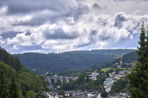 a town in a valley with a bridge in the distance at Chalet La Belle Willingen in Willingen