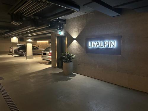 a lit up sign on the side of a parking garage at LIVALPIN ToGether in Garmisch-Partenkirchen