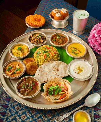 a tray filled with different types of food on a table at Gateway Aurangabad - Chhatrapati Sambhaji Nagar in Aurangabad