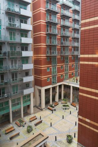 an aerial view of a courtyard in front of tall buildings at Hyatt Regency London Albert Embankment in London