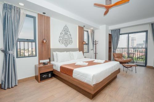 Cama o camas de una habitación en Botum Domrey Hotel