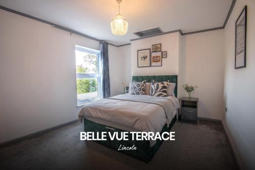 a bedroom with a bed and a window at Bright and Warm Home in Lincoln by Renzo, Free Wi-Fi, Perfect for Staycations! in Lincolnshire