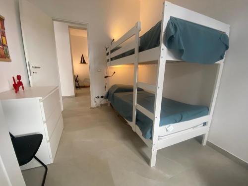 a bedroom with two bunk beds in a room at il posto giusto - the right place in Anzio