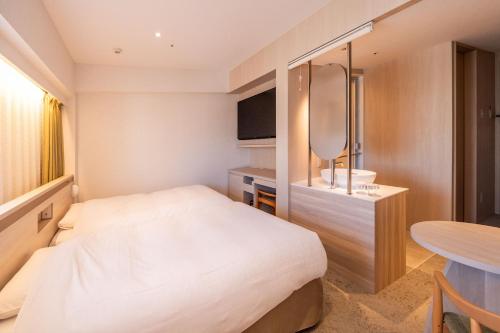 Una cama o camas en una habitación de Richmond Hotel Sendai - Reopened After Renovation on 28 Dec 2024