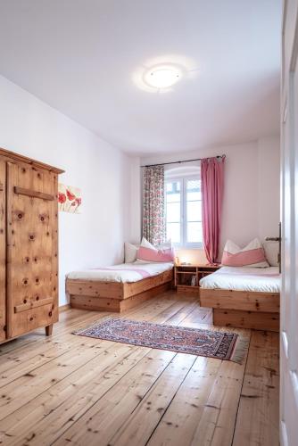 a room with two beds and a window at Domitian 2 in Millstatt