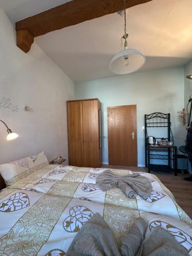 a bedroom with a large bed in a room at Ferienhaus Löwenherz in Pommern