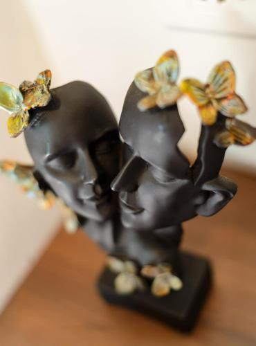 a figurine of a skull with butterflies on it at Nistula Luxury Pool Villa C3 in Assagao in Assagao