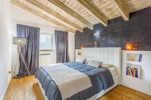 a bedroom with a large bed in a room at Unconventional BnB near Linate - Supreme Meme Loft in Milan