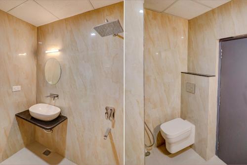 a bathroom with a shower and a toilet and a sink at FabHotel Premium Kashi in Varanasi