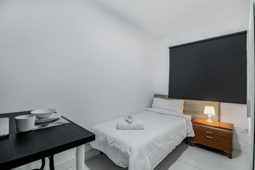 Postel nebo postele na pokoji v ubytování Las Palmas Comfort Rooms
