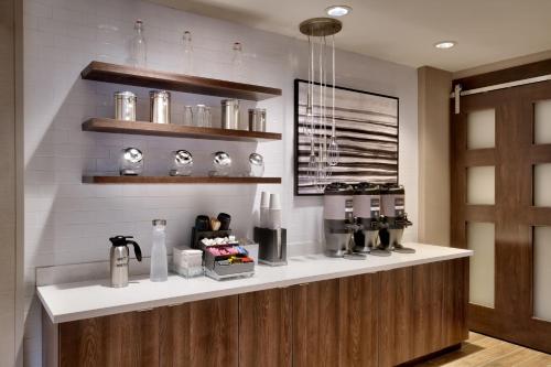 a coffee shop with a counter in a room at Residence Inn by Marriott Brunswick in Brunswick