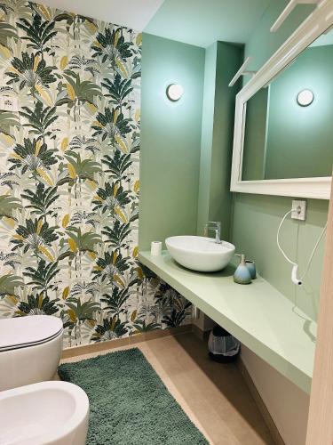 a bathroom with a sink and a toilet at Dimora San Michele in Almese