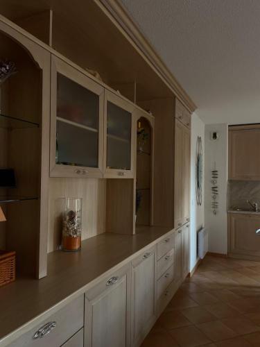 a kitchen with white cabinets and a counter top at Beautiful apartment very close to the sea in Roquebrune-Cap-Martin