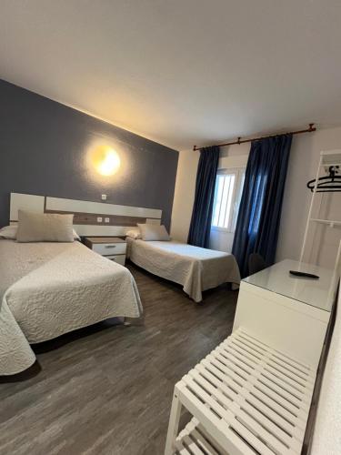 Postel nebo postele na pokoji v ubytování Hostal Azul
