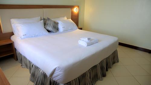 ENN Business Hotelにあるベッド