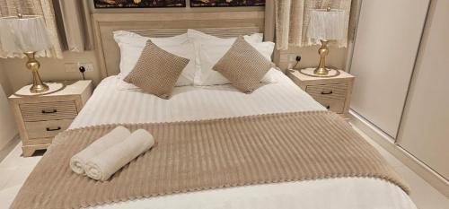 Ένα ή περισσότερα κρεβάτια σε δωμάτιο στο Elite Hawana Salalah