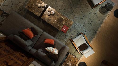 an overhead view of a living room with a couch at Can Cera Hotel in Palma de Mallorca