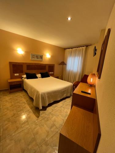 Ένα ή περισσότερα κρεβάτια σε δωμάτιο στο Hostal Azul