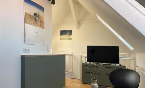 TV o dispositivi per l'intrattenimento presso Bright + Cozy Dachgeschoß Maisonette im Zentrum