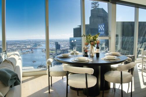 a table in a room with a view of a city at Park Avenue Melbourne in Melbourne