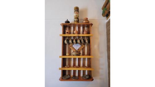 a shelf in a hallway with various items on it at La Vieja Esquina in Cachí