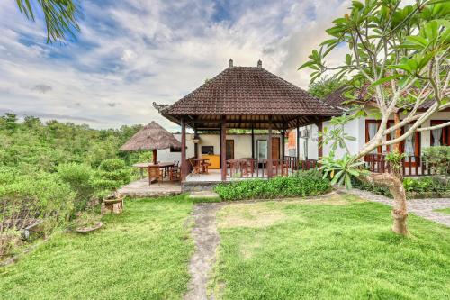 a house with a gazebo in a yard at Innala Retreat Nusa Penida in Nusa Penida