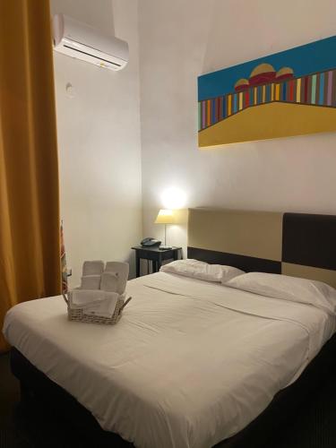 Ένα ή περισσότερα κρεβάτια σε δωμάτιο στο Hotel Plebiscito Aparthotel
