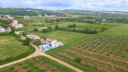 an aerial view of a house in a field at Villa Tiamo in Labinci