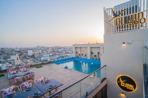 a view of a swimming pool on top of a building at Royal Prime - A City Center Boutique Hotel In Jaipur in Jaipur
