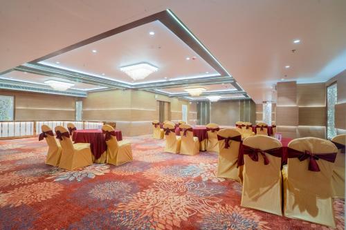 a banquet hall with tables and chairs in a room at Royal Prime - A City Center Boutique Hotel In Jaipur in Jaipur