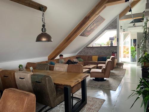 a living room with a table and a couch at Logement Meijnerswijk, Free Parking, Electric Parking, Kitchen,Living room, Free Coffee machine Geen jongeren onder 25 jr in Arnhem