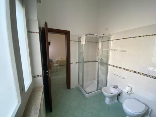 a bathroom with a shower and a toilet and a sink at Le 5 Torri in Trapani