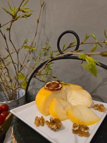 a plate of food with a sliced banana on a table at DS Hotel Lusopark in Santa Maria da Feira