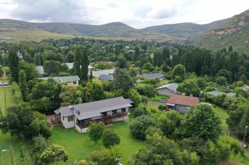 an aerial view of a small village with trees and houses at 727 Church in Clarens
