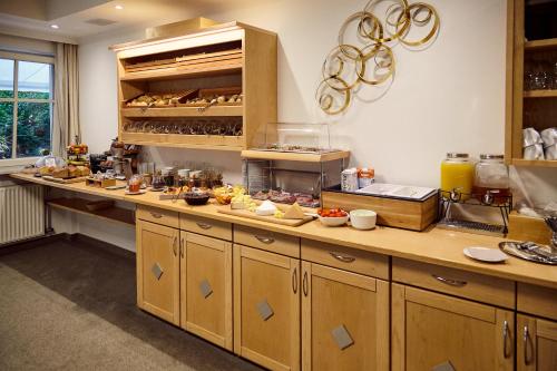 a kitchen with a counter with food on it at Wohlfühlhotel Mei Auszeit in Plaus