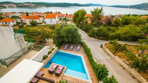 an aerial view of a house with a swimming pool at Villa Nia with private pool in Trogir