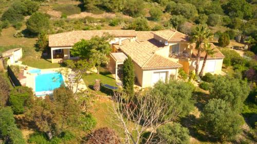 an aerial view of a house with a swimming pool at Fantastic Large Villa with Garden, Pool and Jacuzzi in Néffiès