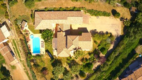 an overhead view of a house with a roof at Fantastic Large Villa with Garden, Pool and Jacuzzi in Néffiès