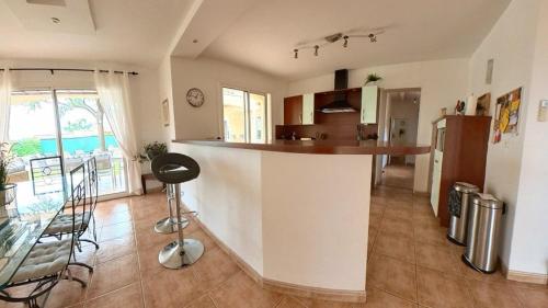 a kitchen with a counter and a counter top in a room at Fantastic Large Villa with Garden, Pool and Jacuzzi in Néffiès