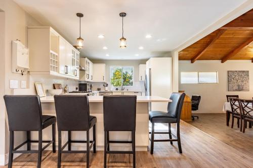 a kitchen and dining room with a table and chairs at Spacious 4BR Retreat near Disneyland & Beaches in Placentia