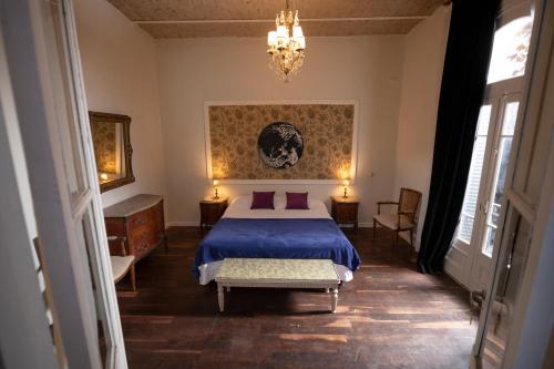 Ένα ή περισσότερα κρεβάτια σε δωμάτιο στο Art House terraza,parrilla en Palermo con desayuno