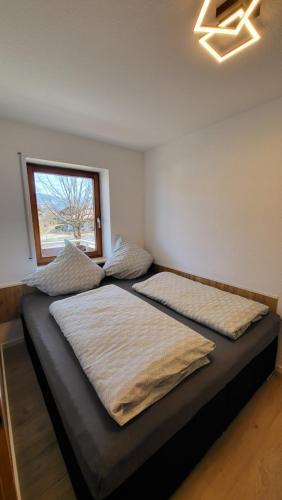 Postel nebo postele na pokoji v ubytování FW2-Allgäu