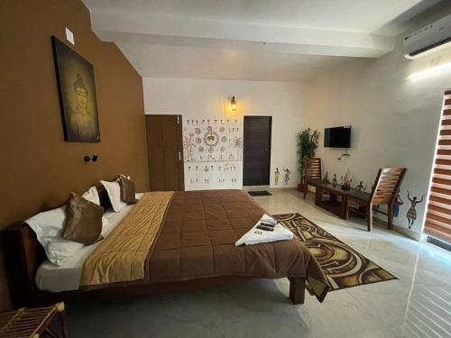a bedroom with a large bed in a room at Uday's Sea Green in Pallipuram