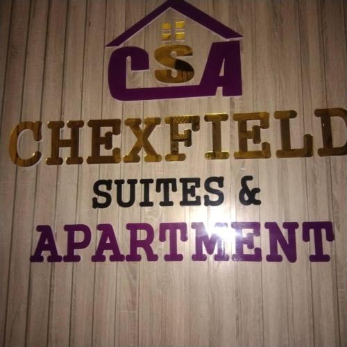 a sign on a wall that reads csa checklist offices and appointment at Chexfield Hotels and Apartments 2427 in Abuja