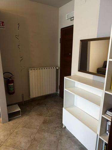 a living room with a white cabinet with a television at "Casa Viola" via Camillo CARLOMAGNO 26 in Isernia
